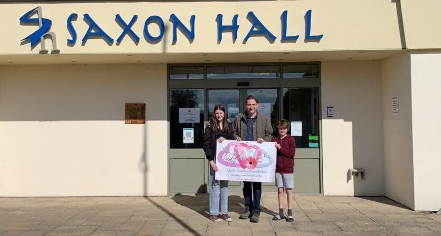 Karl Lansley and children outside Saxon Hall